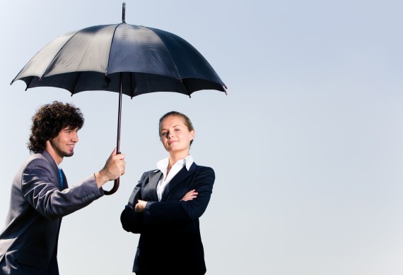 Image of confident business man holding umbrella and looking at woman on the background of sky